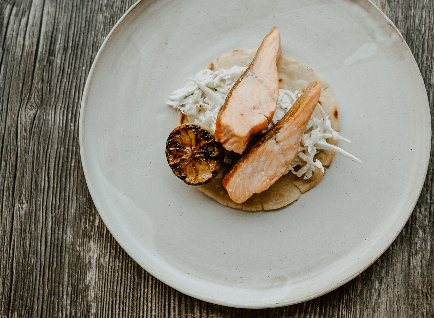 Salmon with charred lemon prepared for private dining