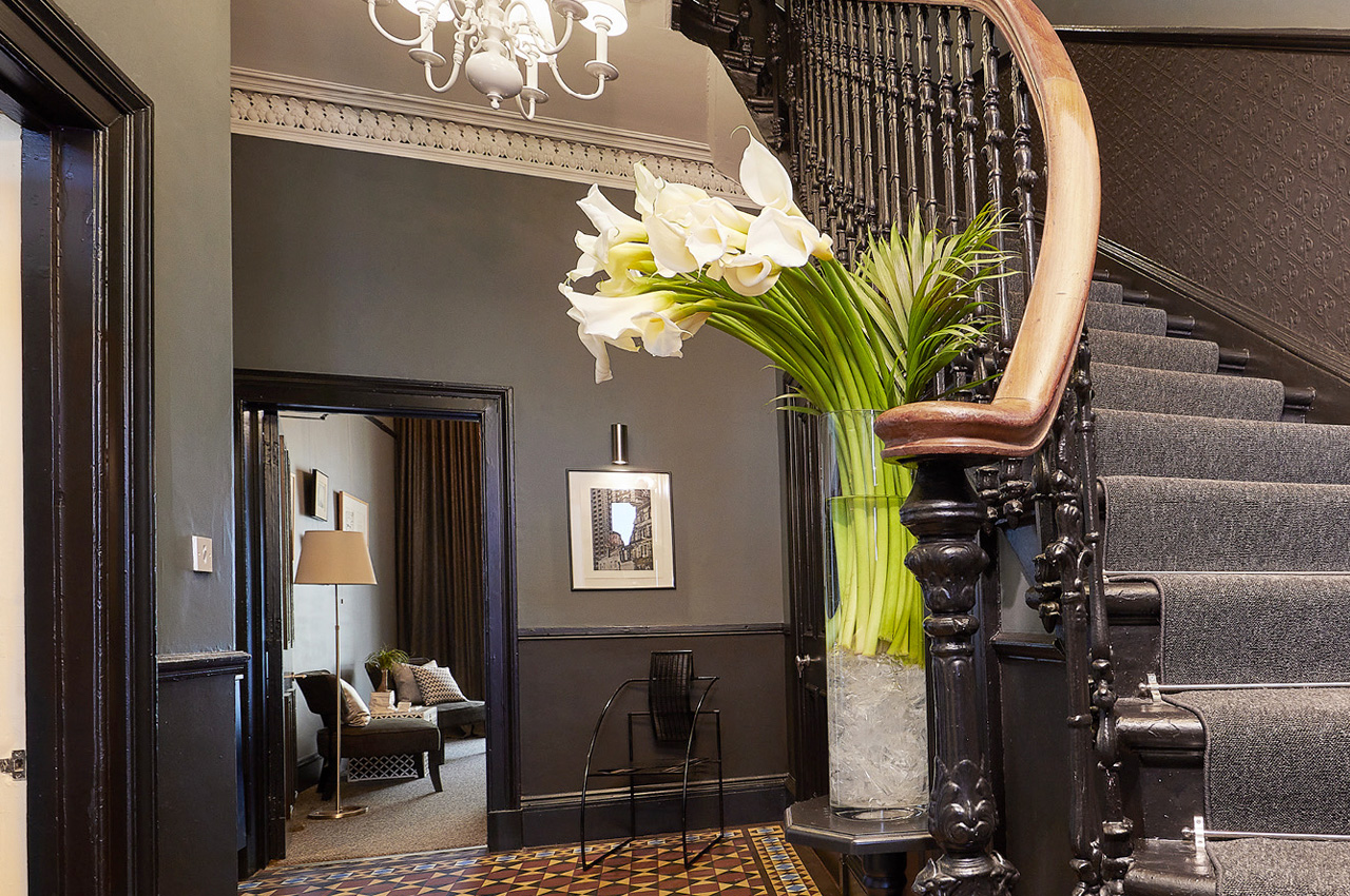 The entrance hall and staircase at 94DR